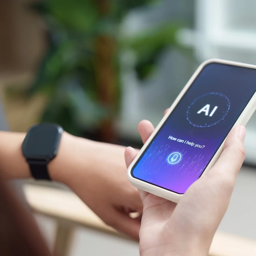 Hand holds a smartphone showing an AI assistant interface for Norwalk businesses.