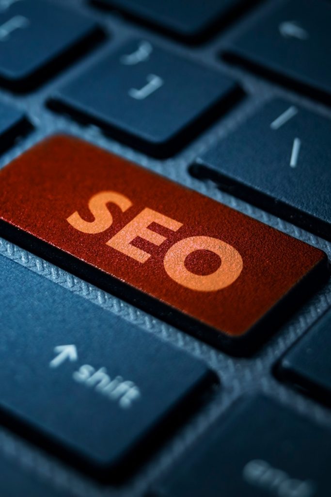 Closeup of a keyboard with an orange key labeled SEO in Norwalk