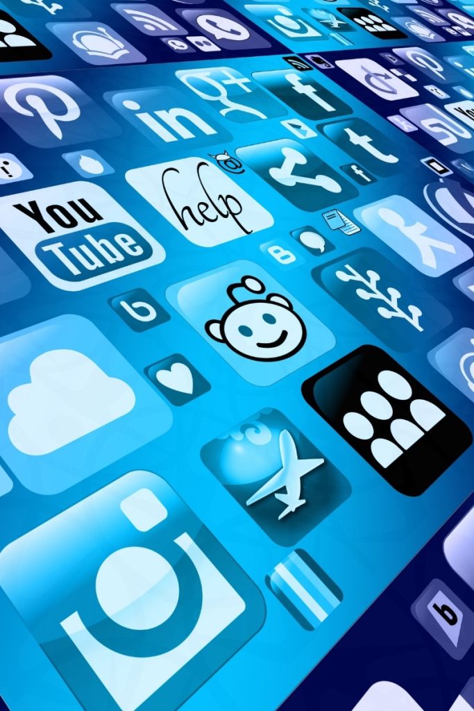 Social media app icons clustered on a blue screen for Norwalk marketing
