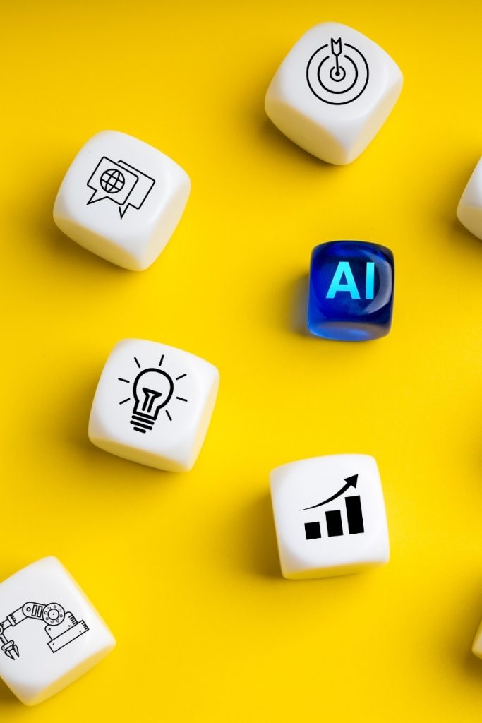 Dice on a yellow background show AI, search, and chart symbols